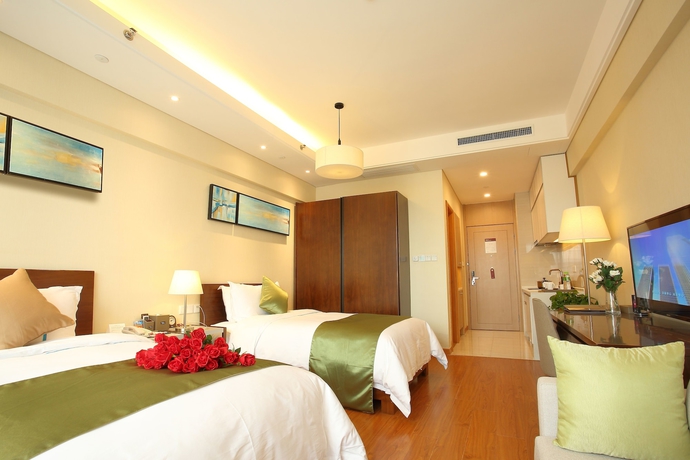 Imagen de la habitación del Hotel Yantai Tianma Argyle Suites. Foto 10