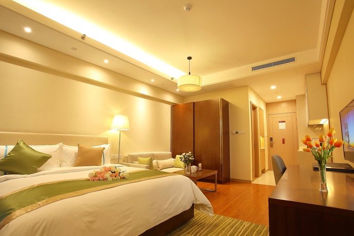 Imagen de la habitación del Hotel Yantai Tianma Argyle Suites. Foto 12