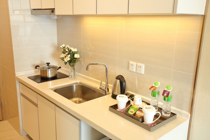 Imagen de la habitación del Hotel Yantai Tianma Argyle Suites. Foto 13