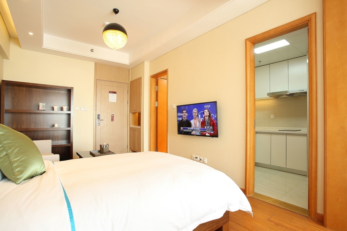 Imagen de la habitación del Hotel Yantai Tianma Argyle Suites. Foto 14