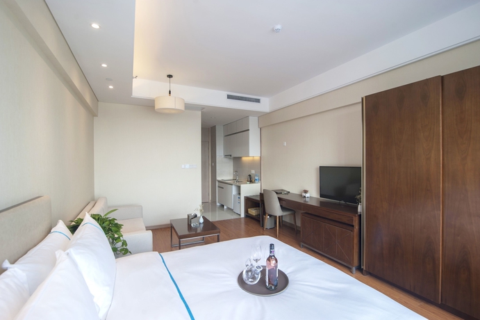 Imagen de la habitación del Hotel Yantai Tianma Argyle Suites. Foto 15