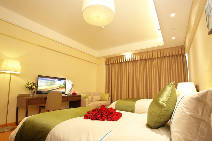 Imagen de la habitación del Hotel Yantai Tianma Argyle Suites. Foto 16