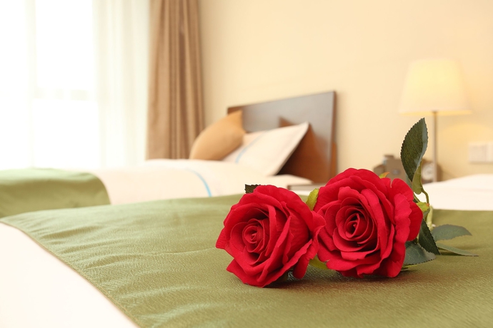 Imagen de la habitación del Hotel Yantai Tianma Argyle Suites. Foto 17