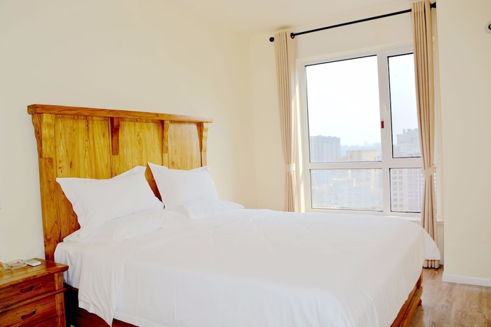 Imagen de la habitación del Hotel Yantai Tianma Xiangcheng Apartment. Foto 3