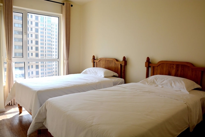 Imagen de la habitación del Hotel Yantai Tianma Xiangcheng Apartment. Foto 5