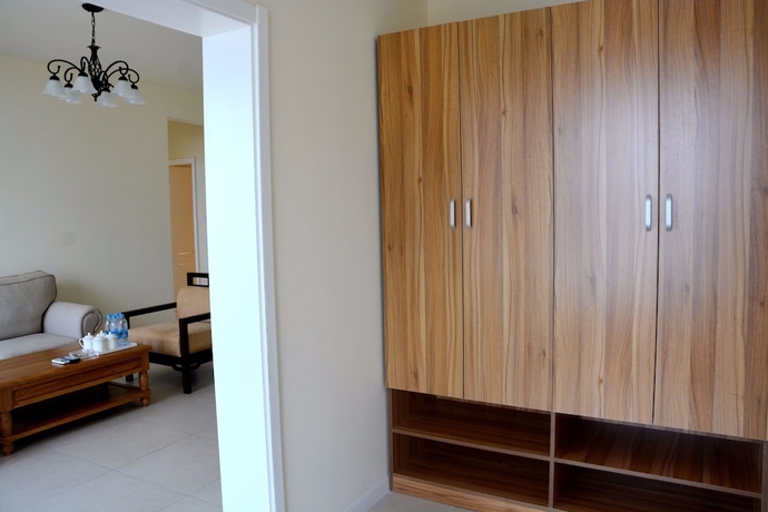 Imagen de la habitación del Hotel Yantai Tianma Xiangcheng Apartment. Foto 8