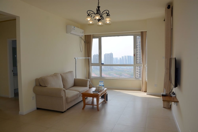 Imagen de la habitación del Hotel Yantai Tianma Xiangcheng Apartment. Foto 9
