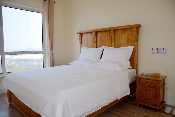 Imagen de la habitación del Hotel Yantai Tianma Xiangcheng Apartment. Foto 11