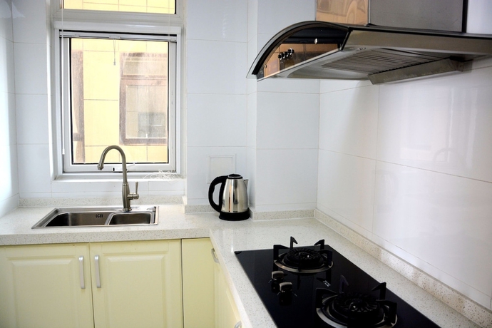 Imagen de la habitación del Hotel Yantai Tianma Xiangcheng Apartment. Foto 12