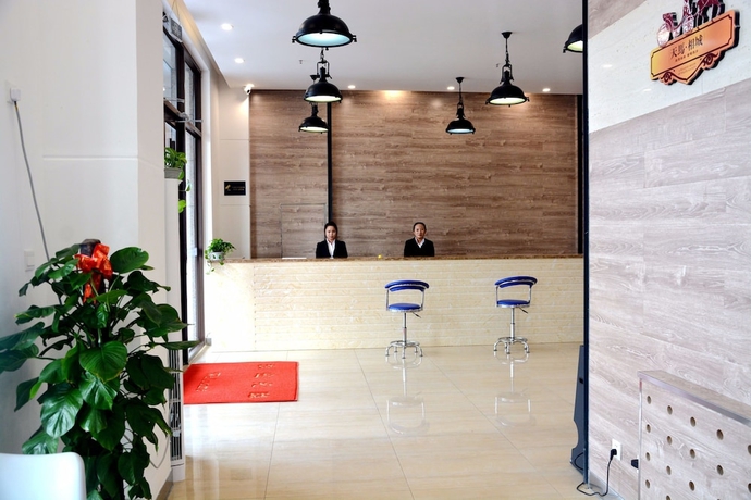 Imagen de los interiores del Hotel Yantai Tianma Xiangcheng Apartment. Foto 18
