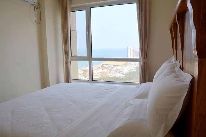 Imagen de la habitación del Hotel Yantai Tianma Xiangcheng Apartment. Foto 14