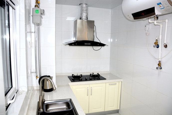 Imagen de la habitación del Hotel Yantai Tianma Xiangcheng Apartment. Foto 16