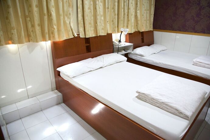 Imagen de la habitación del Hotel Yau King. Foto 15