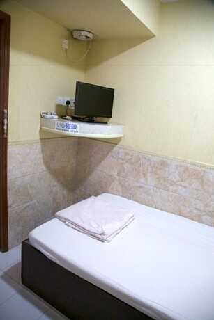 Imagen de la habitación del Hotel Yau King. Foto 16