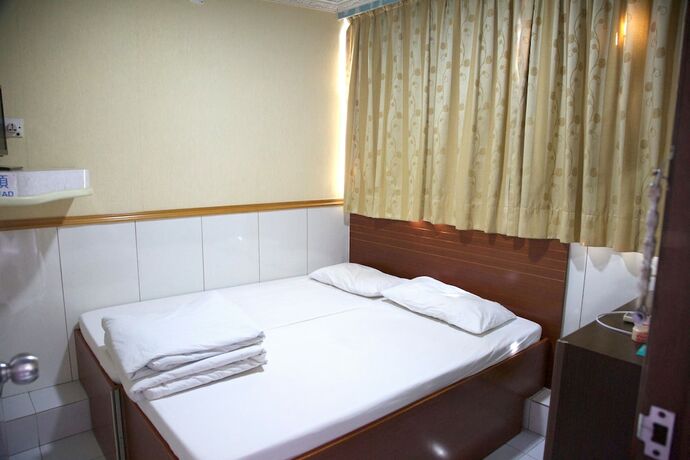 Imagen de la habitación del Hotel Yau King. Foto 21