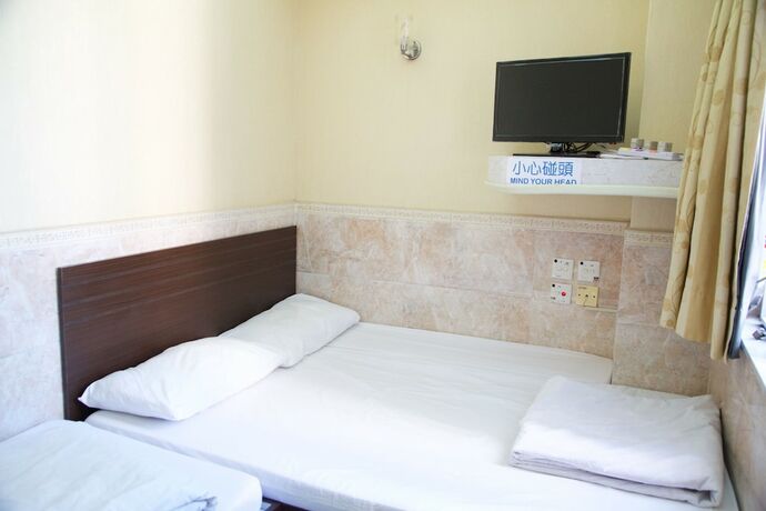 Imagen de la habitación del Hotel Yau King. Foto 23