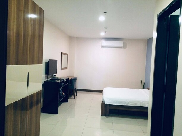Imagen de la habitación del Hotel Ybc Grand. Foto 15