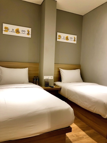Imagen de la habitación del Hotel Yellow Bee Tanah Abang. Foto 2
