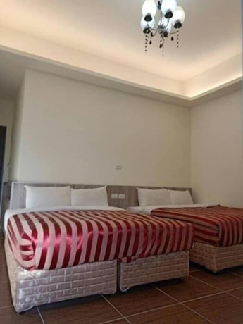 Imagen de la habitación del Hotel Yi Jia Fu Yuan. Foto 7