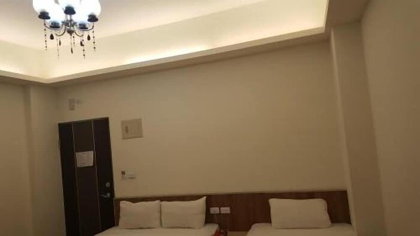 Imagen de la habitación del Hotel Yi Jia Fu Yuan. Foto 11