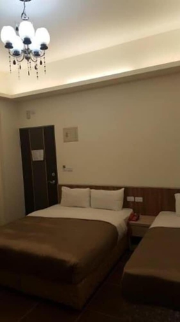 Imagen de la habitación del Hotel Yi Jia Fu Yuan. Foto 12