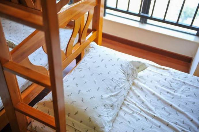 Imagen de la habitación del Hotel Yi Jia Ren Hostel. Foto 3