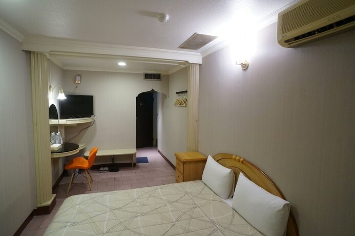 Imagen de la habitación del Hotel Yi Yuan. Foto 8