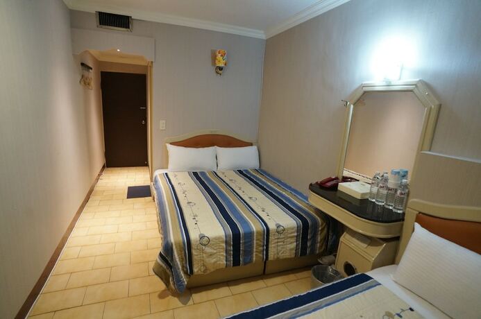 Imagen de la habitación del Hotel Yi Yuan. Foto 12