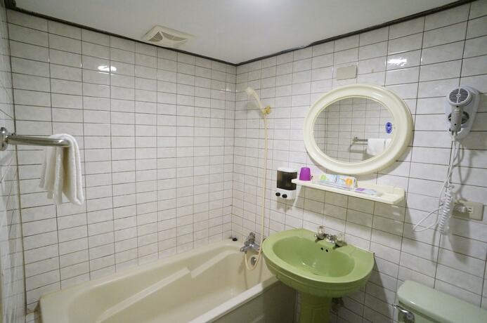Imagen de la habitación del Hotel Yi Yuan. Foto 13