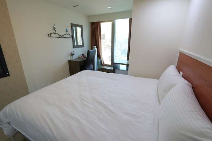 Imagen de la habitación del Hotel Yidianyuan Hotel. Foto 2