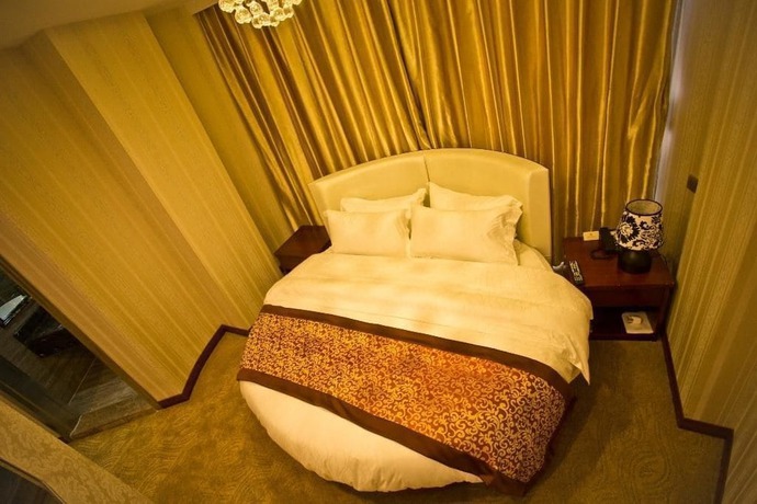 Imagen de la habitación del Hotel Yihaige Culture Hotel. Foto 3