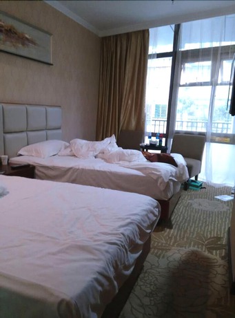 Imagen de la habitación del Hotel Yihaige Culture Hotel. Foto 5