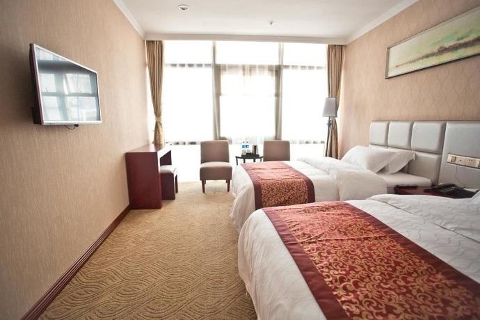 Imagen de la habitación del Hotel Yihaige Culture Hotel. Foto 8