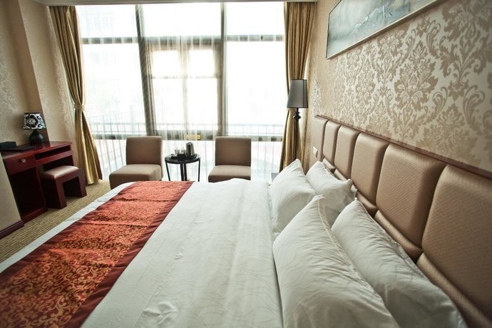 Imagen de la habitación del Hotel Yihaige Culture Hotel. Foto 10