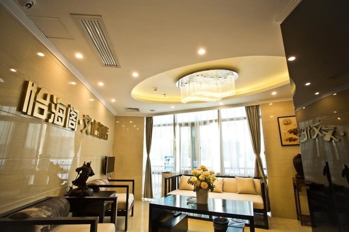 Imagen de la habitación del Hotel Yihaige Culture Hotel. Foto 12