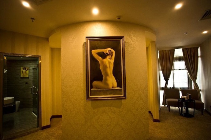 Imagen de la habitación del Hotel Yihaige Culture Hotel. Foto 13