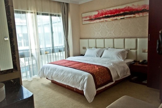 Imagen de la habitación del Hotel Yihaige Culture Hotel. Foto 15
