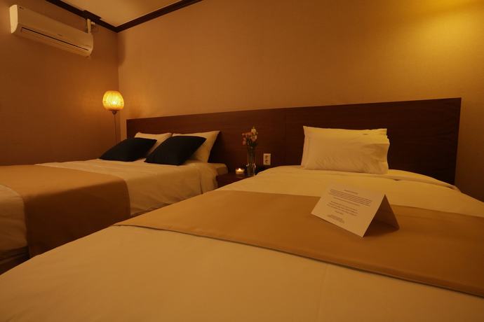 Imagen de la habitación del Hotel Yihua Hotel. Foto 2