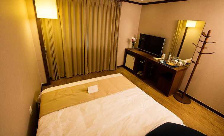 Imagen de la habitación del Hotel Yihua Hotel. Foto 11