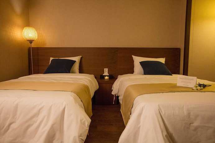 Imagen de la habitación del Hotel Yihua Hotel. Foto 16