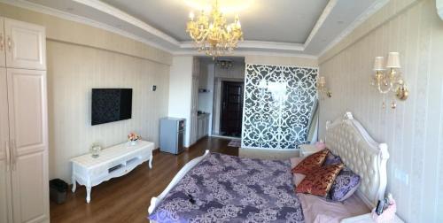 Imagen de la habitación del Hotel Yijia Apartment. Foto 8