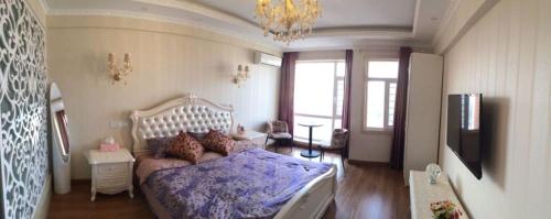 Imagen de la habitación del Hotel Yijia Apartment. Foto 9