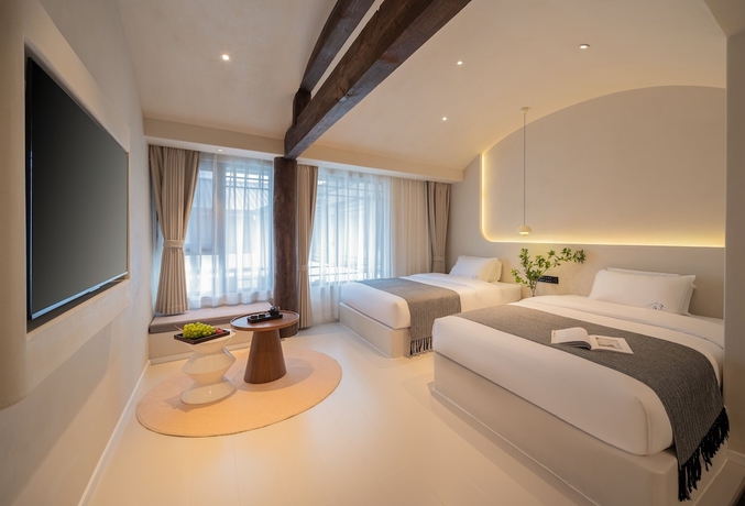 Imagen de la habitación del Hotel Yijianju Garden Inn. Foto 4