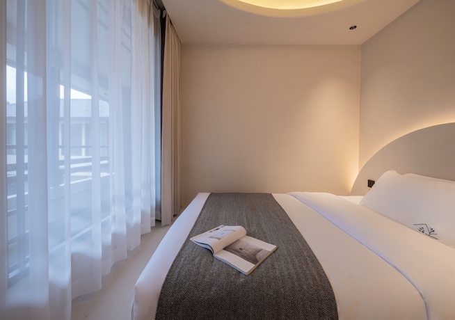 Imagen de la habitación del Hotel Yijianju Garden Inn. Foto 7