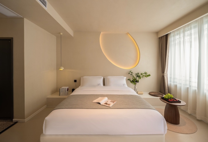 Imagen de la habitación del Hotel Yijianju Garden Inn. Foto 9