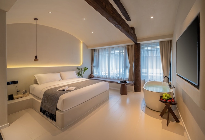 Imagen de la habitación del Hotel Yijianju Garden Inn. Foto 10