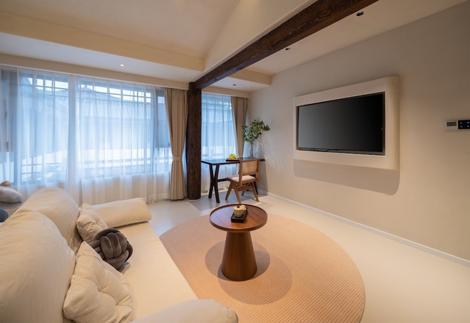 Imagen de la habitación del Hotel Yijianju Garden Inn. Foto 11