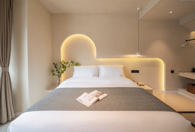 Imagen de la habitación del Hotel Yijianju Garden Inn. Foto 12