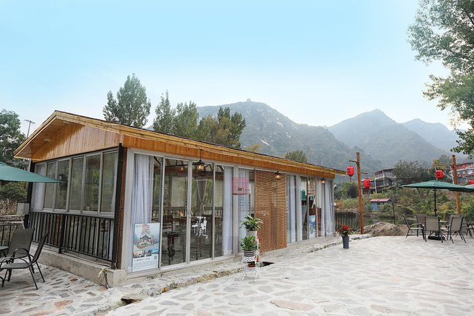 Imagen del bar/restaurante del Hotel Yijie Holiday Huairou Shentangyu. Foto 5