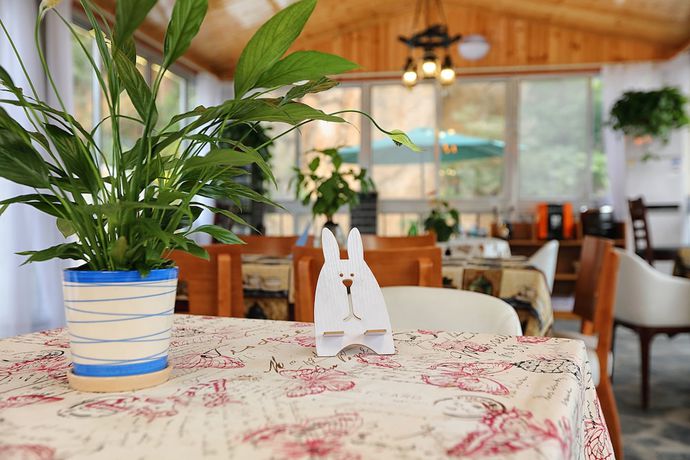 Imagen del bar/restaurante del Hotel Yijie Holiday Huairou Shentangyu. Foto 6